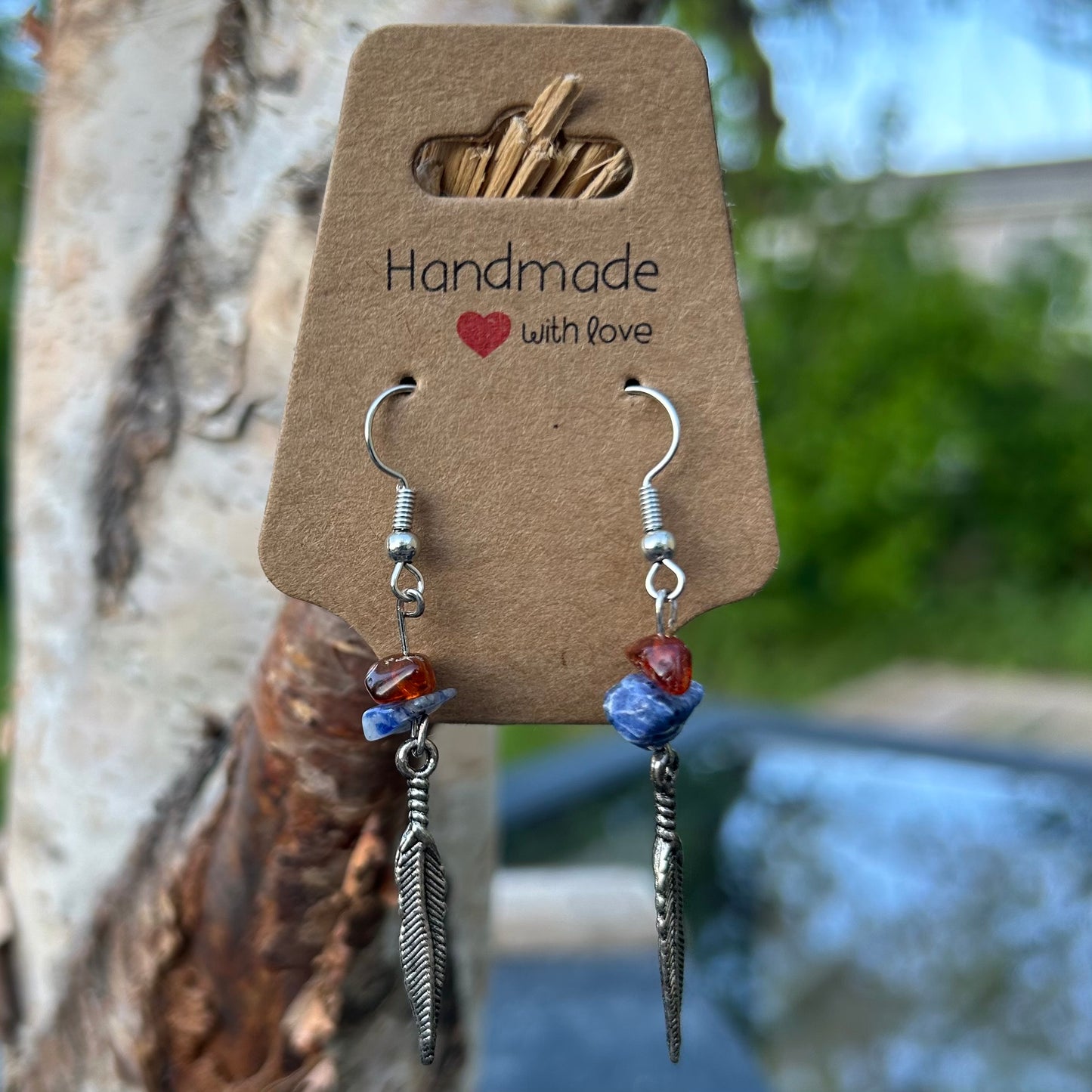 Feather charm earrings