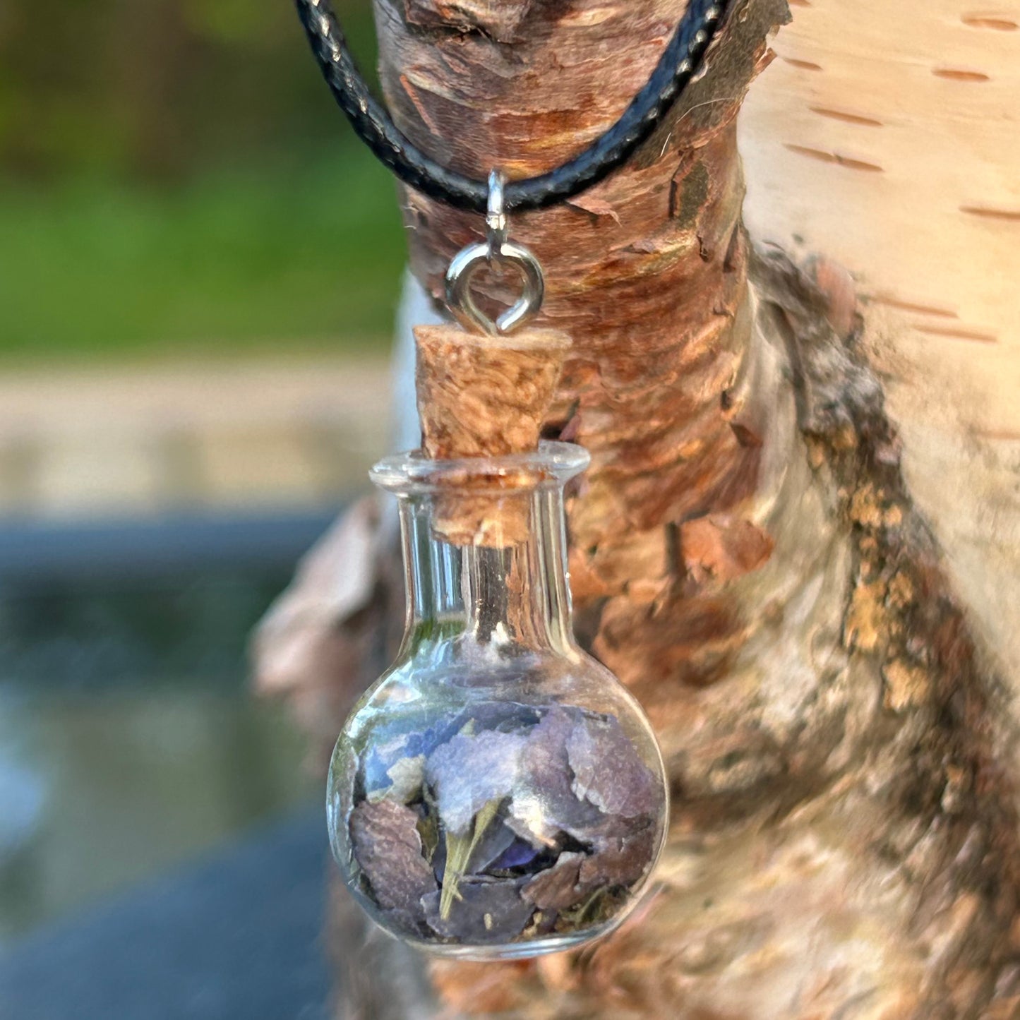 Peace spell bottle necklace